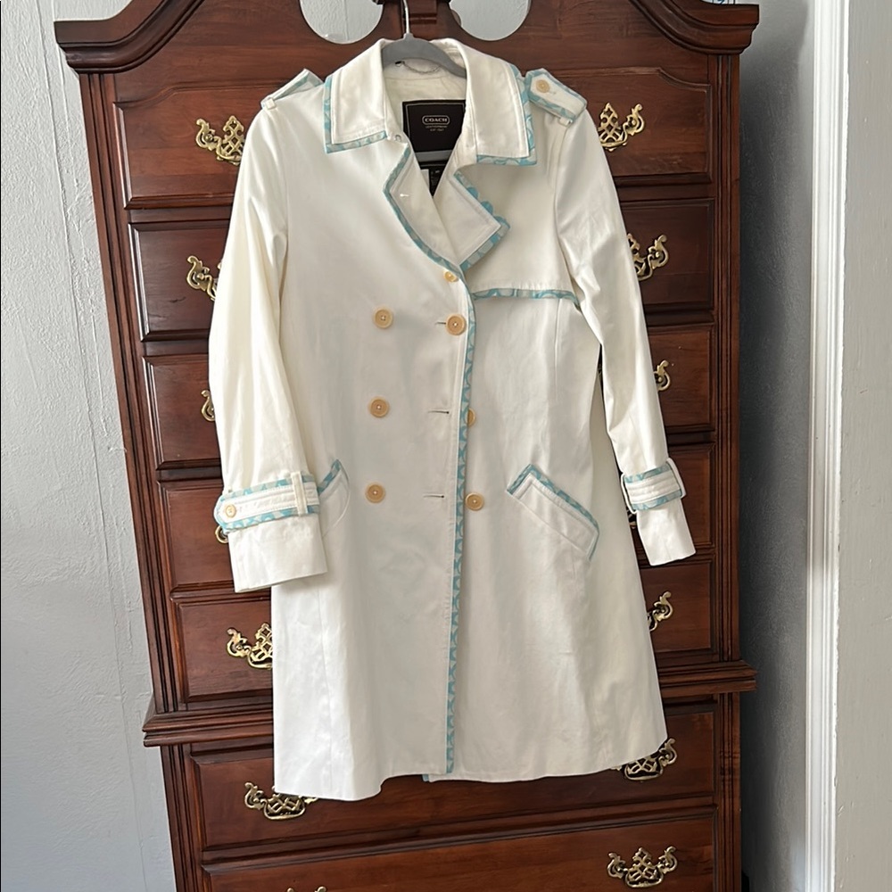 Elegant White Coach Coat with Teal Accents